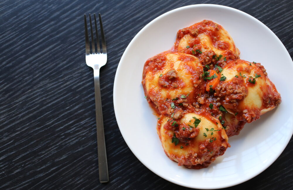 Cheese Ravioli with Bolognese and Parmigiano