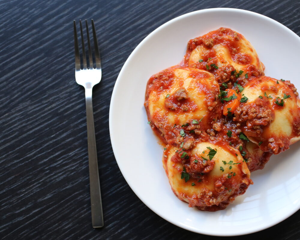 Cheese Ravioli with Bolognese and Parmigiano