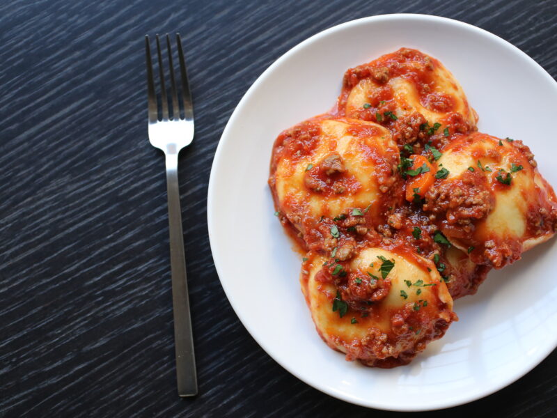 Cheese Ravioli with Bolognese and Parmigiano