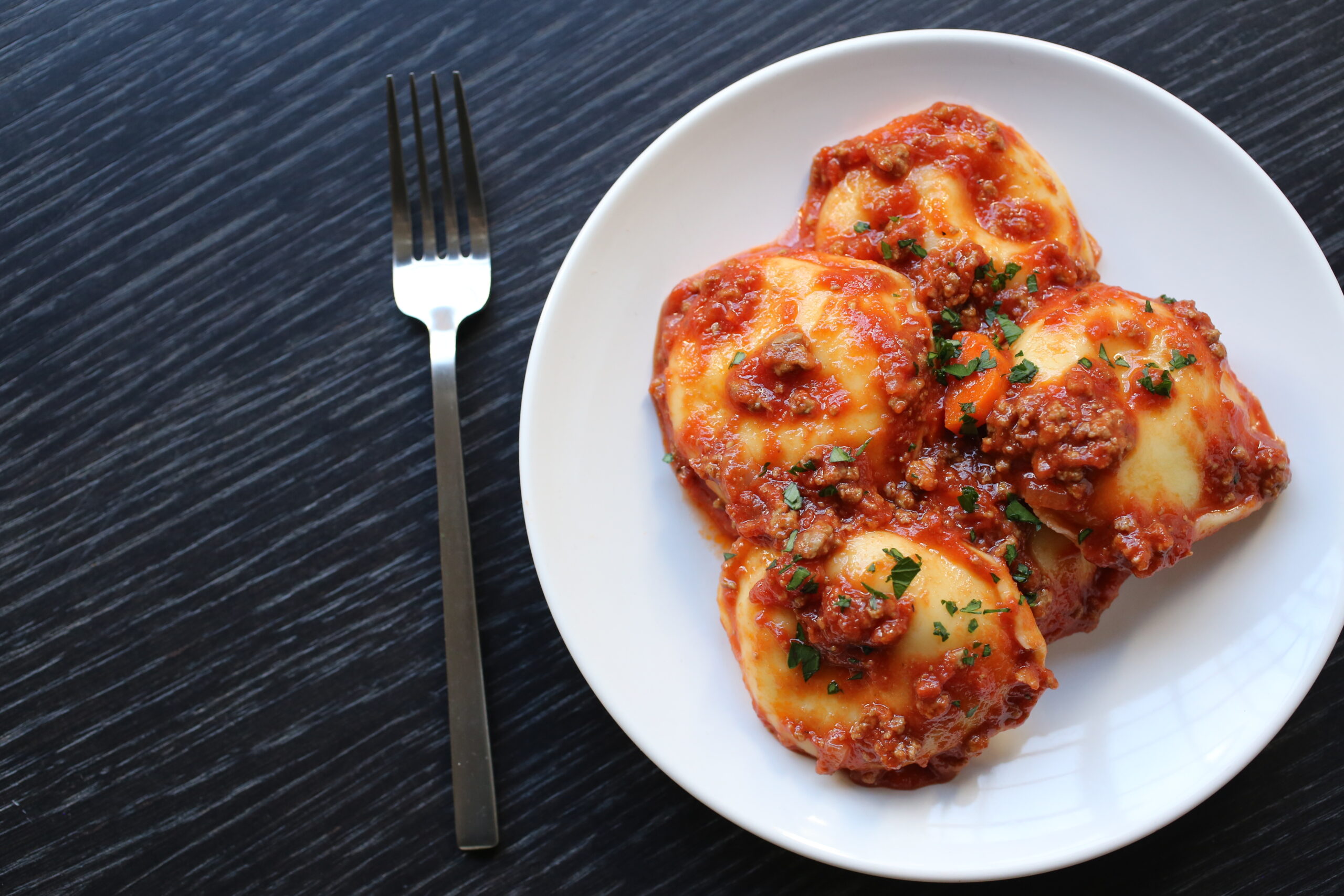 Cheese Ravioli with Bolognese and Parmigiano – Pastosa Ravioli